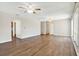 Bright living room with hardwood floors, ceiling fan, and neutral color scheme at 8520 Woodall Ct, Tampa, FL 33615