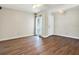 Elegant living room with hardwood floors, white trim, and ample natural light at 8520 Woodall Ct, Tampa, FL 33615
