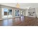 Bright living room with hardwood floors, a fireplace, and large windows offering backyard views at 8520 Woodall Ct, Tampa, FL 33615