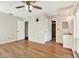 The main bedroom includes wood floors, ceiling fan and a vanity with a doorway to a shower room at 8520 Woodall Ct, Tampa, FL 33615