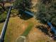 An aerial view of a yard enclosed by a white fence, offering ample space and privacy at 8926 Garner Ct, Trinity, FL 34655