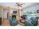 Comfortable living room with a fireplace and entertainment center at 8926 Garner Ct, Trinity, FL 34655