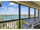 Spacious balcony with seating to enjoy the stunning views of the Intracoastal Waterway and surrounding cityscape at 9425 Blind Pass Rd # 802, St Pete Beach, FL 33706
