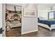Walk-in closet provides generous storage, complemented by hardwood floors and the natural light from the adjacent bedroom at 9425 Blind Pass Rd # 802, St Pete Beach, FL 33706