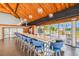 Stylish clubhouse with vaulted ceilings, long bar counter, and views of the pool at 9425 Blind Pass Rd # 802, St Pete Beach, FL 33706