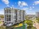 Scenic view of the condo complex with lush landscaping and water features at 9425 Blind Pass Rd # 802, St Pete Beach, FL 33706