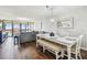 Open concept living area with access to the balcony at 9425 Blind Pass Rd # 802, St Pete Beach, FL 33706