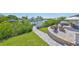 Well-maintained backyard with boat dock, hot tub, outdoor kitchen, and fire pit, perfect for waterfront living at 945 Bunker View Dr, Apollo Beach, FL 33572