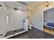 Modern bathroom with glass-enclosed shower and black hexagonal tile at 945 Bunker View Dr, Apollo Beach, FL 33572
