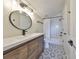 Modern bathroom features new vanity and light fixtures with a shower-tub combination at 945 Bunker View Dr, Apollo Beach, FL 33572