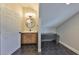 Stylish bathroom with a modern vanity, round mirror, unique lighting, and eye-catching black and white hexagon tiled floor at 945 Bunker View Dr, Apollo Beach, FL 33572