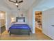 Comfortable bedroom with a view of a closet with built in shelves at 945 Bunker View Dr, Apollo Beach, FL 33572