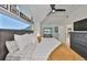 Bedroom with a large window and a view to a seating area at 945 Bunker View Dr, Apollo Beach, FL 33572