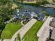 A beautiful two-story waterfront home with lush landscaping and a long driveway at 945 Bunker View Dr, Apollo Beach, FL 33572