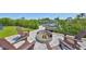 Cozy backyard fire pit with seating, perfect for relaxing evenings and enjoying the waterfront views at 945 Bunker View Dr, Apollo Beach, FL 33572