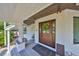 Charming front porch with decorative wreath and welcoming entryway detail at 945 Bunker View Dr, Apollo Beach, FL 33572
