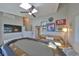 A game room with skylights, multiple windows, and a poker table, complete with a sofa for watching the game at 945 Bunker View Dr, Apollo Beach, FL 33572