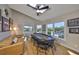 Game room featuring a poker table, comfortable seating, natural light, and scenic waterfront views, perfect for entertaining at 945 Bunker View Dr, Apollo Beach, FL 33572