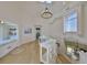 Well-lit hallway with white trim and custom railing overlooking the downstairs at 945 Bunker View Dr, Apollo Beach, FL 33572