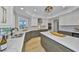 Gourmet kitchen with custom cabinetry, quartz countertops, stainless steel appliances, and a center island at 945 Bunker View Dr, Apollo Beach, FL 33572