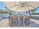 Entertain outdoors with the built-in kitchen and stone bar top with stainless steel appliances at 945 Bunker View Dr, Apollo Beach, FL 33572
