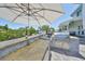 Entertain outdoors with the built-in kitchen and stone bar top with stainless steel appliances at 945 Bunker View Dr, Apollo Beach, FL 33572