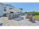 Entertain outdoors with the built-in kitchen, stone bar top, and outdoor fireplace and seating at 945 Bunker View Dr, Apollo Beach, FL 33572