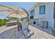 Outdoor kitchen with bar, grill, and hot tub, perfect for al fresco dining and entertaining in style at 945 Bunker View Dr, Apollo Beach, FL 33572