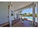 Covered patio with dining area offering a view of the pool and outdoor lounge area, great for al fresco dining at 945 Bunker View Dr, Apollo Beach, FL 33572