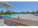 Luxury pool with lounge chairs and a view, complete with poolside seating, umbrellas and bench at 945 Bunker View Dr, Apollo Beach, FL 33572