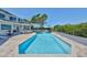 Inviting pool area with a long, narrow pool, lounge area, and landscaped surroundings at 945 Bunker View Dr, Apollo Beach, FL 33572