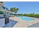 Inviting pool area with a long, narrow pool, lounge area, and landscaped surroundings at 945 Bunker View Dr, Apollo Beach, FL 33572
