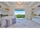 Comfortable window seat with built-in bookshelves, offering a charming space to unwind with a picturesque outdoor view at 945 Bunker View Dr, Apollo Beach, FL 33572