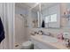 Clean bathroom featuring a shower, neutral tiles, and functional vanity with storage at 9511 45Th N St # 9511, Pinellas Park, FL 33782