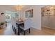 Dining room with elegant chandelier, hardwood floors, and seating for six, perfect for gatherings at 9511 45Th N St # 9511, Pinellas Park, FL 33782