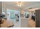 Well-lit kitchen featuring modern appliances, island, and seamless access to the living and dining spaces at 9511 45Th N St # 9511, Pinellas Park, FL 33782