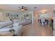 Spacious living room featuring hardwood floors that connects seamlessly to the dining area at 9511 45Th N St # 9511, Pinellas Park, FL 33782