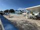 Beautiful outdoor pool with blue tiled patio and shaded seating areas at 9511 45Th N St # 9511, Pinellas Park, FL 33782
