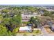 Aerial view of a quaint single-Gathering home featuring a well-maintained lawn and fenced-in yard at 10011 N Annette Ave, Tampa, FL 33612