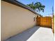 A new, wood fence encloses a concrete patio area in a large, private backyard at 10011 N Annette Ave, Tampa, FL 33612