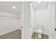 This bathroom features a walk-in closet and a toilet at 10011 N Annette Ave, Tampa, FL 33612