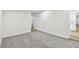 This bedroom offers neutral carpet and bright, freshly painted walls at 10011 N Annette Ave, Tampa, FL 33612