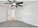 Bedroom with gray carpet flooring, white walls, and updated white door frames and doors at 10011 N Annette Ave, Tampa, FL 33612