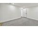 This bedroom offers neutral carpet and white walls for a bright, airy feel at 10011 N Annette Ave, Tampa, FL 33612