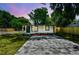 Charming single-story home with new landscaping, a freshly painted exterior, and a modern stone driveway at 10011 N Annette Ave, Tampa, FL 33612