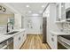 This updated kitchen boasts modern appliances and sleek quartz countertops at 10011 N Annette Ave, Tampa, FL 33612