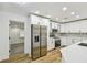 Updated kitchen featuring stainless steel appliances and ample counter space at 10011 N Annette Ave, Tampa, FL 33612