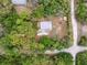Aerial shot showcases a secluded home site bordered by mature trees and offering privacy from the road at 10502 Atlee St, New Port Richey, FL 34654