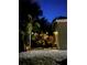 The exterior of the home with a deck and accent lighting at twilight at 10502 Atlee St, New Port Richey, FL 34654