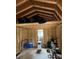 Interior shows unfinished walls, exposed beams, and items stored in the attic space at 10502 Atlee St, New Port Richey, FL 34654